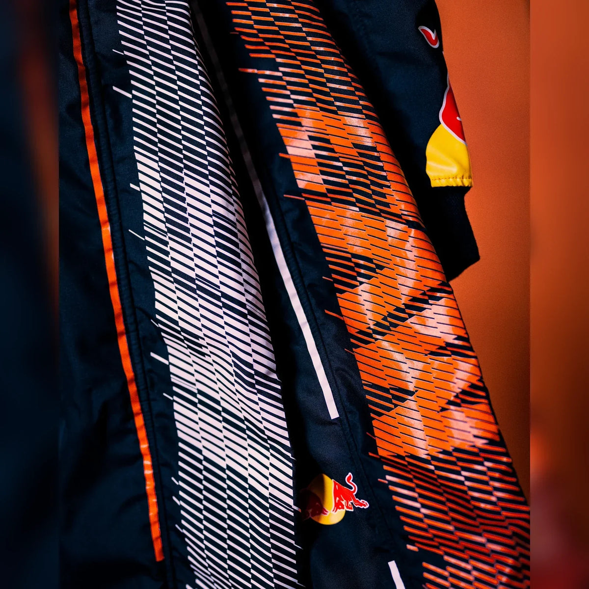2026 Zandvoort race suit orange and white fabric detail by Trending Racegear