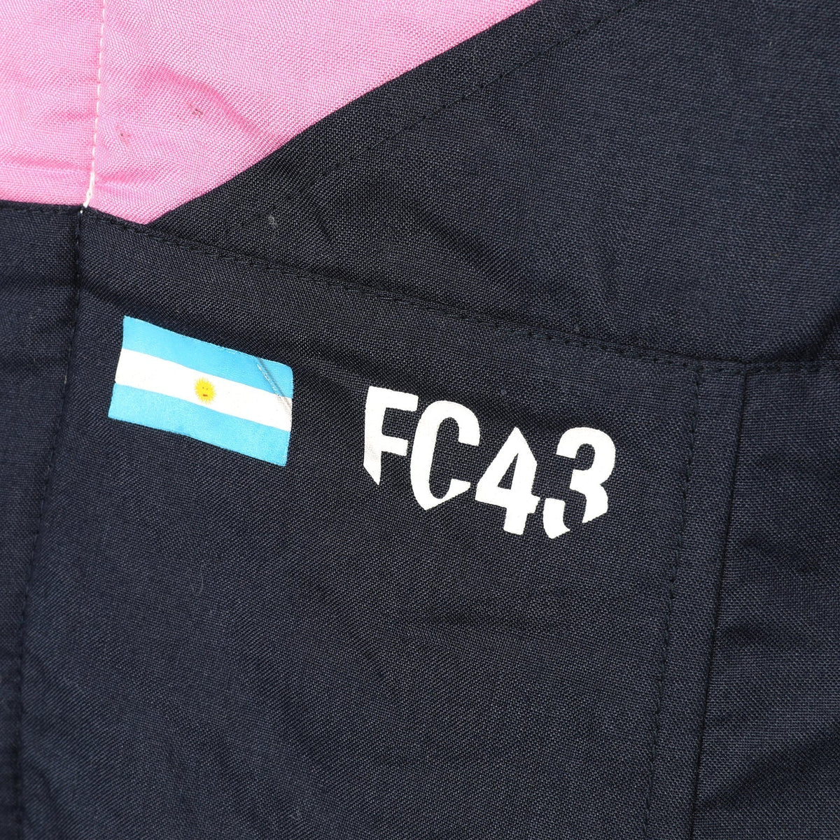 Franco Colapinto FC43 and Argentina flag detail on the 2026 Alpine F1 race suit – Trending Racegear.